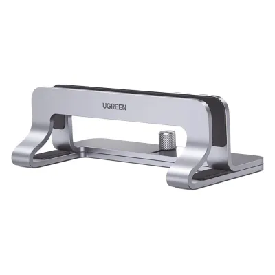 Soporte Vertical para Laptop / Adecuado para escritorio / Anchura Ajustable (12-26mm) / Amplia compatibilidad / Anti-Arañazos / Anti-Deslizante /Ajustable Mediante Tornillos / Color Plata / Aluminio + Silicona